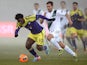 Swansea's Wilfried Bony and St Gallen's Muhamed Demiri in action during their Europa League group match on December 12, 2013