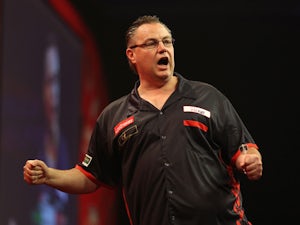John Part of Canada celebrates winning a leg during his first round match against Mareno Michels of The Netherlands during the Ladbrokes.com World Darts Championship on Day One at Alexandra Palace on December 13, 2013