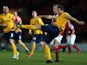 Johnny Mullins of Oxford United clears the ball during the FA Cup Second Round match between Wrexham AFC and Oxford United at Racecourse Ground on December 9, 2013