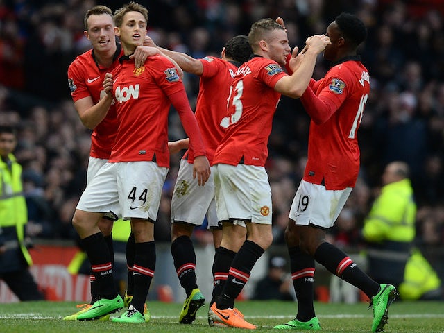 Manchester United's Belgium midfielder Adnan Januzaj celebreates with team-mates after a goal against West Hamon December 21, 2013
