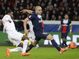Paris Saint-Germain's Brazilian defender Alex vies for the ball with Lille's Ivorian forward Salomon Kalou during the French L1 football match on December 22, 2013