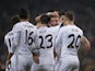 Real Madrid's midfielder Asier Illarramendi (2ndR) celebrates with teammates after scoring during the Spanish Copa del Rey (King's Cup) finals stage second-leg football match against Olimpic on December 18, 2013