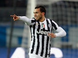Carlos Tevez of Juventus celebrates after scoring his team opening goal during the Serie A match between Atalanta BC and Juventus at Stadio Atleti Azzurri d'Italia on December 22, 2013
