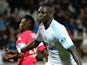 Marseille's French defender Benjamin Mendy celebrates after scoring a goal during the French League Cup round of sixteen football match Marseille vs Toulouse on December 18, 2013