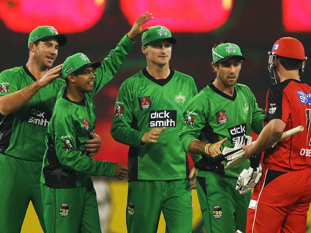 John Hastings, Clive Rose, Jackson Bird and Glenn Maxwell of the Stars celebrate their win next to Aaron O'Brien of the Renegades during the Big Bash League match between the Melbourne Stars and the Melbourne Renegades at Melbourne Cricket Ground on Decem