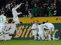 Moenchengladbach's players celebrate during the German first division Bundesliga football match Borussia Moenchengladbach vs VfL Wolfsburg in the German city of Moenchengladbach on December 22, 2013