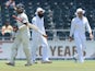 Indian batsman Cheteshwar Pujara walks off the field after being bolwed by South African bowler Jacques Kallis on the fourth day of a cricket Test match on December 21, 2013