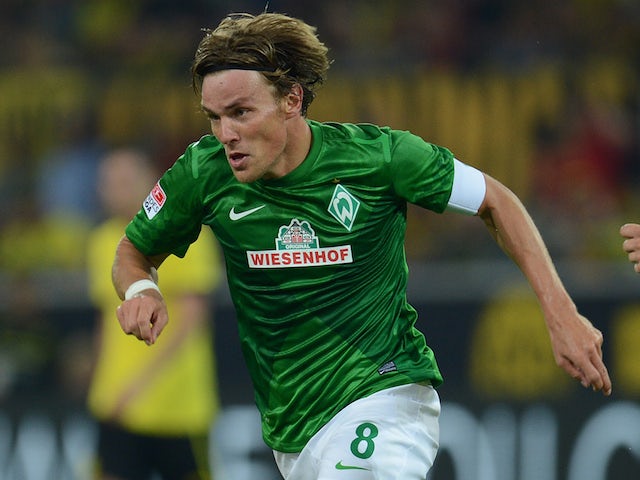 Werder Bremen's defender Clemens Fritz playing the ball during the German first division Bundesliga football match against Borussia Dortmund on August 24, 2012