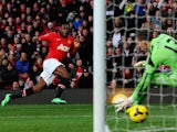 Manchester United's English striker Danny Welbeck scores the opening goal past West Ham United's Spanish goalkeeper Adrian during the English Premier League football match on December 21, 2013