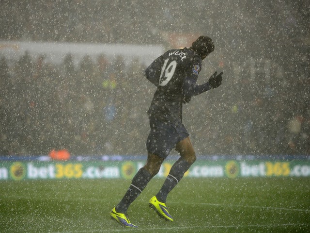 Danny Welbeck of Manchester United in action as heavy hail falls during the Capital One Cup Quarter Final against Stoke City on December 18, 2013