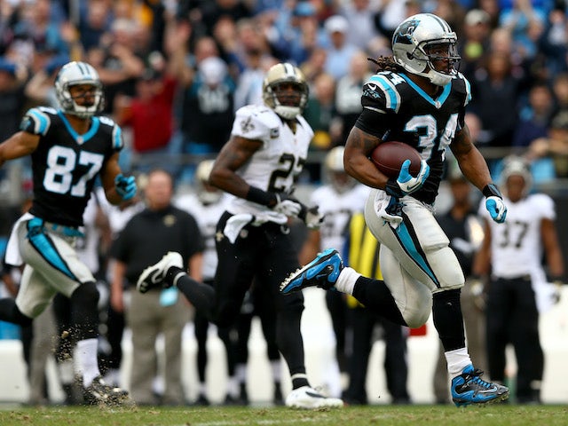 DeAngelo Williams of the Carolina Panthers runs for a touchdown during their game against the New Orleans Saints at Bank of America Stadium on December 22, 2013
