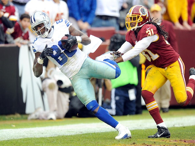 Dez Bryant of the Dallas Cowboys catches a touchdown in the second quarter against the Washington Redskins at FedExField on December 22, 2013