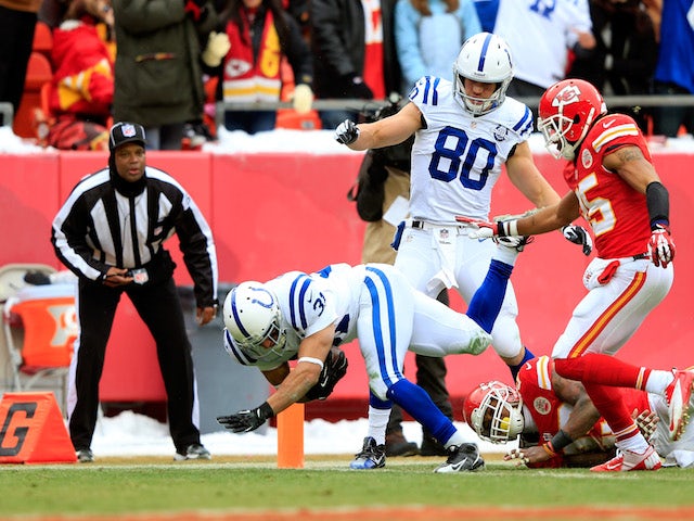 Running back Donald Brown of the Indianapolis Colts dives across the goal line for a touchdown during the 1st half of the game against the Kansas City Chiefs on December 22, 2013