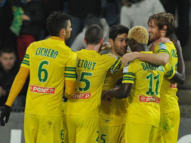 Nantes' Fernando Aristeguieta celebrates with teammates after scoring the opening goal against Auxerre during their French League Cup match on December 17, 2013
