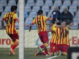 Barcelona's forward Pedro Rodriguez celebrates with teammates after scoring during the Spanish league football match Getafe CF vs FC Barcelona at the Alfonso Perez Coliseum in Getafe on December 22, 2013