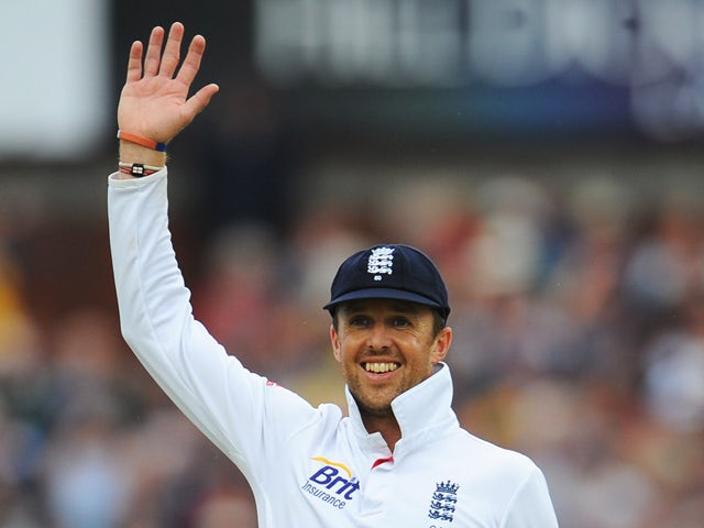 Graeme Swann of England waves in the field during day four of the 3rd Investec Ashes Test match between England and Australia at Emirates Old Trafford Cricket Ground on August 4, 2013