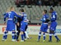 Bastia's Brazilian forward Ilan Araujo is congratulated by team mates after scoring a goal during a French League Cup round of sixteen football match against Evian on December 18, 2013