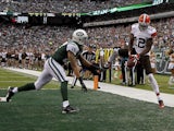 Josh Gordon of the Cleveland Browns tries to catch a pass in front of Dee Milliner of the New York Jets during their game at MetLife Stadium on December 22, 2013