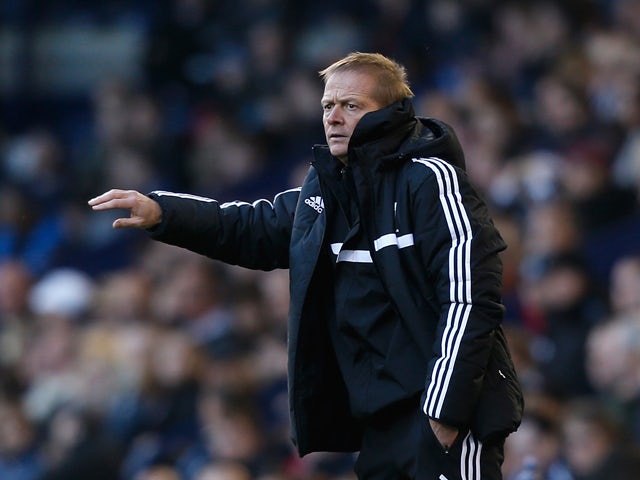 West Brom assistant head coach Keith Downing gestures during the Barclays Premier League match between West Bromwich Albion and Crystal Palace at The Hawthorns on November 2, 2013