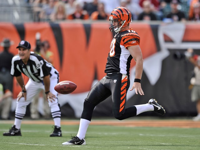 Punter Kevin Huber #10 of the Cincinnati Bengals punts against the the San Fracisco 49ers at Paul Brown Stadium on September 25, 2011