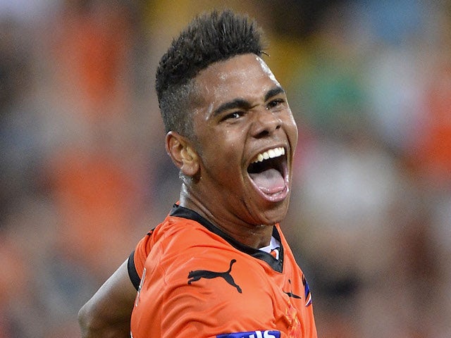 Kwame Yeboah of the Roar celebrates after scoring a goal during the round seven A-League match between the Brisbane Roar and the Western Sydney Wanderers on November 22, 2013