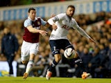 Kyle Walker of Tottenham Hotspur holds off Matthew Jarvis of West Ham United during the Capital One Cup Quarter-Final match on December 18, 2013