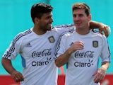 Lionel Messi and Sergio Aguero embrace during an Argentina training session on September 06, 2013.
