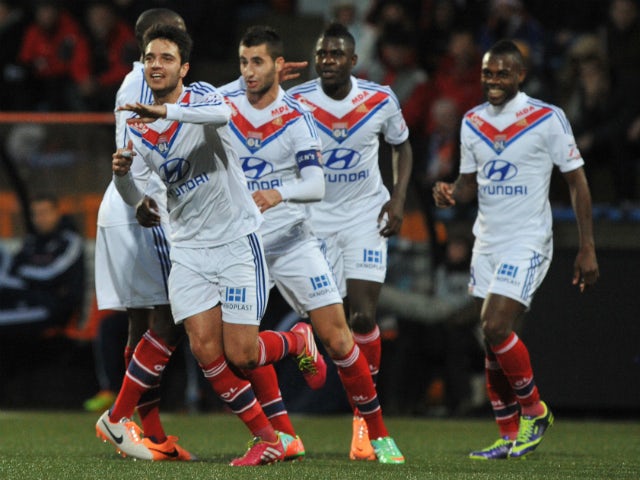 Lyon's French midfielder Clement Grenier celebrates with teammates after scoring during the French L1 football match between Lorient and Lyon on December 22, 2013