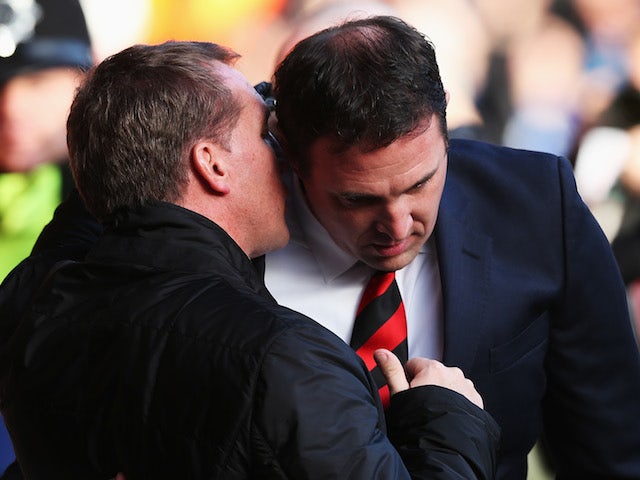 Cardiff City manager Malky Mackay talks with Liverpool manager Brendan Rogers before the Barclays Premier League match on December 21, 2013