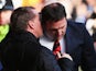 Cardiff City manager Malky Mackay talks with Liverpool manager Brendan Rogers before the Barclays Premier League match on December 21, 2013