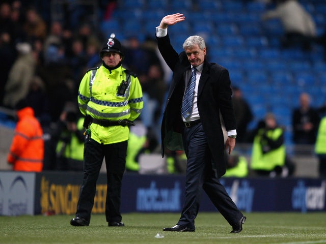 Manchester City manager Mark Hughes waves to the crowd after the Barclays Premier League match between Manchester City and Sunderland at the City of Manchester Stadium on December 19, 2009