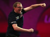 Mark Webster of Wales celebrates winning his first round match against Mensur Suljovic of Austria during the Ladbrokes.com World Darts Championship on Day Six at Alexandra Palace on December 19, 2013
