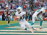 Michael Thomas #31 of the Miami Dolphins celebrates a game clinching interception during a game against the New England Patriots at Sun Life Stadium on December 15, 2013