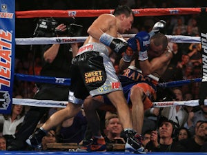 Ruslan Provodnikov of Russia knocks down Mike Alvarado on the ropes in the eighth round at the 1stBank Center on October 19, 2013