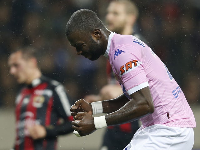 Evian's Congolese defender Cedric Mongongu celebrates after scoring a goal during the French L1 football match Nice (OGC Nice) vs Evian (ETGFC) on December 21, 2013 