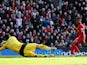 Raheem Sterling of Liverpool slots the ball past David Marshall the Cardiff City goalkeeper to score his sides second goal during the Barclays Premier League on December 21, 2013