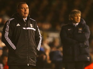 Manager Rene Meulensteen of Fulham looks on during the Barclays Premier League match between Fulham and Manchester City at Craven Cottage on December 21, 2013