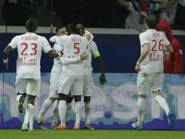 Lille's French midfielder Rio Mavuba celebrates with teammates after scoring a goal during the French L1 football match against Paris Saint-Germain on December 22, 2013