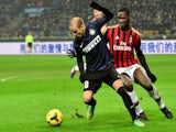 AC Milan's French defender Kevin Constant fights for the ball with Inter Milan's Argentinian forward Rodrigo Palacio during the Italian Serie A football match on December 22, 2013