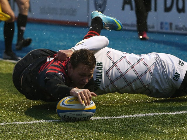 Jack Wilson of Saracens dives over for the first try during the Aviva Premiership match between Saracens and Leicester Tigers at Allianz Park on December 21, 2013