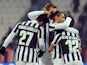 Sebastian Giovinco of Juventus celebrates with team-mates after scoring the opening goal with team-mate during the Tim Cup match against US Avellino on December 18, 2013