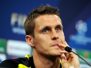 Sebastian Kehl speaks during a Borussia Dortmund press conference ahead of the UEFA Champions League final match against FC Bayern Muenchen at Wembley Stadium on May 24, 2013