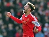 Southampton's English midfielder Adam Lallana celebrates scoring the opening goal during the English Premier League football match between Southampton and Tottenham Hotspur at St Mary's Stadium in Southampton, southern England on December 22, 2013