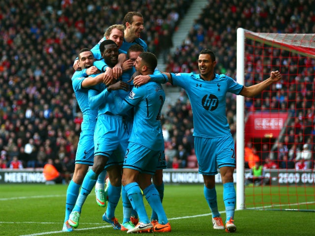 Emanuel Adebayor of Spurs celebrates with teammates after scoring his team's third goal during the Barclays Premier League match between Southampton and Tottenham Hotspur at St Mary's Stadium on December 22, 2013