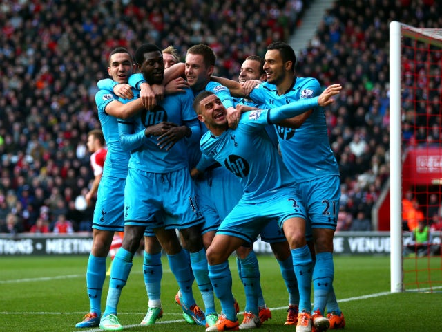 Emmanuel Adebayor of Spurs celebrates with teammates after scoring his team's third goal during the Barclays Premier League match between Southampton and Tottenham Hotspur at St Mary's Stadium on December 22, 2013