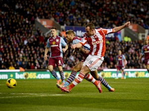 Charlie Adam of Stoke City scores their first goal during the Barclays Premier League match between Stoke City and Aston Villa at Britannia Stadium on December 21, 2013