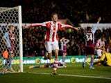 Peter Crouch of Stoke City celebrates as he scores their second goal during the Barclays Premier League match between Stoke City and Aston Villa at Britannia Stadium on December 21, 2013