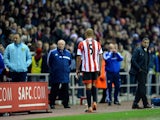 Wes Brown of Sunderland walks off the pitch after being sent off for a challenge on Robert Snodgrass of Norwich City during the Barclays Premier League match between Sunderland and Norwich City at the Stadium of Light on December 21, 2013