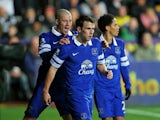 Seamus Coleman of Everton is congratulated by teammate Ross Barkley of Everton after scoring the opening goal during the Barclays Premier League match between Swansea City and Everton at the Liberty Stadium on December 22, 2013