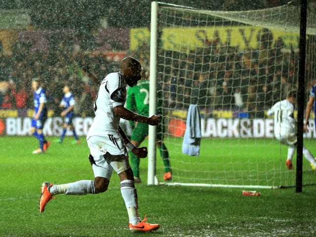 Dwight Tiendalli of Swansea's celebrates after his header on goal is deflected by Bryan Oviedo of Everton for an own goal during the Barclays Premier League match between Swansea City and Everton at the Liberty Stadium on December 22, 2013